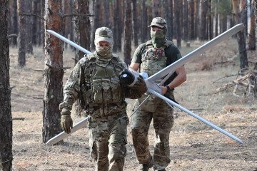 Russian troops carry a Lancet loitering munition during preparations for combat deployment. (Source: Russian media) Russian troops carry a Lancet loitering munition during preparations for combat deployment. (Source: Russian media)