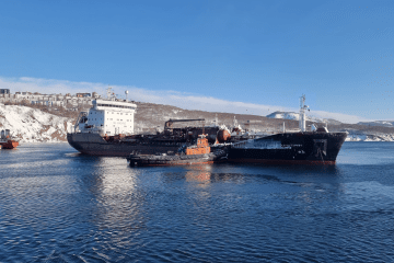 The Russian-flagged oil tanker Aram Khachaturian, identified in an investigation into fuel shipments from South Korea to Russia, pictured alongside a tugboat. (Photo: Shipspotting)
