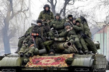 Russian soldiers sit atop a tank in an unidentified location. (Photo: Open source)