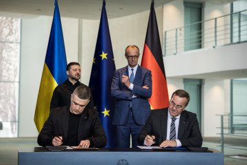 German Chancellor Friedrich Merz and Ukrainian President Volodymyr Zelenskyy look as German and Ukrainian Defense Ministers Boris Pistorius and Mykhailo Fedorov sign a cooperation agreement on April 14, 2026, in Berlin, Germany. (Source: Getty Images) German Chancellor Friedrich Merz and Ukrainian President Volodymyr Zelenskyy look as German and Ukrainian Defense Ministers Boris Pistorius and Mykhailo Fedorov sign a cooperation agreement on April 14, 2026, in Berlin, Germany. (Source: Getty Images)