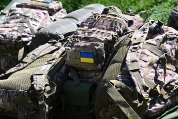 A Ukrainian flag badge is pictured on equipment as Ukrainian soldiers take part in trench warfare exercises at a British Army military base in Northern England on June 2, 2023. (Source: Getty Images)