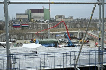 Hungarian and Russian national flags are seen on a wall near workers and vehicles at the Paks II contruction site near the city of Paks, southern Hungary, on February 5, 2026. (Source: Getty Images) Hungarian and Russian national flags are seen on a wall near workers and vehicles at the Paks II contruction site near the city of Paks, southern Hungary, on February 5, 2026. (Source: Getty Images)