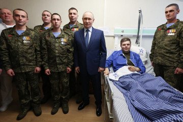 Russia’s leader Vladimir Putin (C) meets with servicemen from the 127th Separate Reconnaissance Brigade during a visit to a military hospital in Moscow on October 29, 2025. (Source: Getty Images) Russia’s leader Vladimir Putin (C) meets with servicemen from the 127th Separate Reconnaissance Brigade during a visit to a military hospital in Moscow on October 29, 2025. (Source: Getty Images)