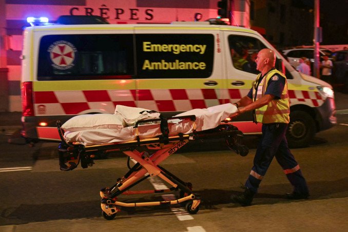 A health worker moves a stretcher after a shooting incident at Bondi Beach in Sydney on December 14, 2025. (Source: Getty Images) A health worker moves a stretcher after a shooting incident at Bondi Beach in Sydney on December 14, 2025. (Source: Getty Images)