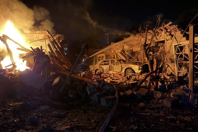 A Ukrainian rescuer works at the site of a Russian strike in Zaporizhzhia on August 11, 2026.