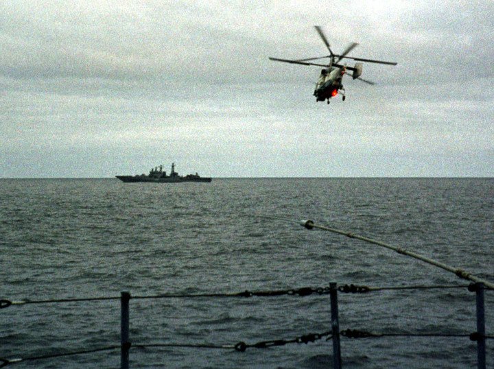 A Russian helicopter patrols the site of the Kursk submarine disaster in the Barents Sea, as official narratives begin to unravel. August 2000. (Source: Getty Images) A Russian helicopter patrols the site of the Kursk submarine disaster in the Barents Sea, as official narratives begin to unravel. August 2000. (Source: Getty Images)