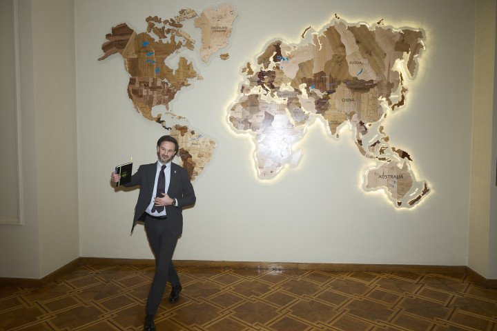 Heorhii and the map on the sidelines of the Ministry of Foreign Affairs. Photo: Joshua Olley/UNITED24 Media.