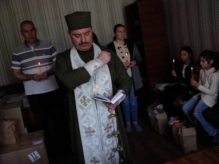 Father Mykola with a brief service. Photo: Joshua Olley Father Mykola with a brief service. Photo: Joshua Olley