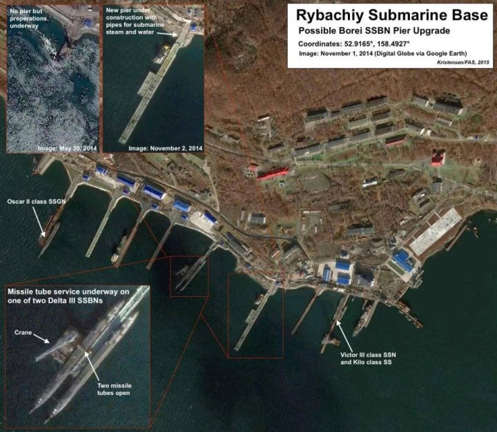 Satellite image of Russia’s Rybachiy Submarine Base showing piers, nuclear submarines, and infrastructure upgrades, including Borei SSBN pier construction and Delta III missile tube maintenance. (Source: FAS via Google Earth, 2014–2015) Satellite image of Russia’s Rybachiy Submarine Base showing piers, nuclear submarines, and infrastructure upgrades, including Borei SSBN pier construction and Delta III missile tube maintenance. (Source: FAS via Google Earth, 2014–2015)