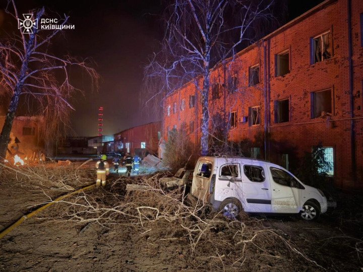 Emergency responders inspect damage near a residential building after a Russian missile and drone attack in the Kyiv region on March 14, 2026. (Source: State Emergency Service of Ukraine in the Kyiv region)