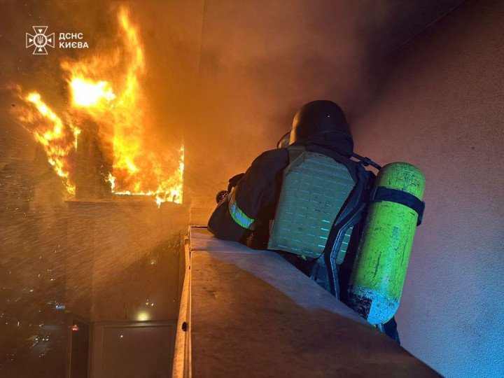 The photo captures Ukrainian State Emergency Service (SESU) firefighters in Kyiv as they work to contain a fire caused by Russian drone strike. The photo captures Ukrainian State Emergency Service (SESU) firefighters in Kyiv as they work to contain a fire caused by Russian drone strike.