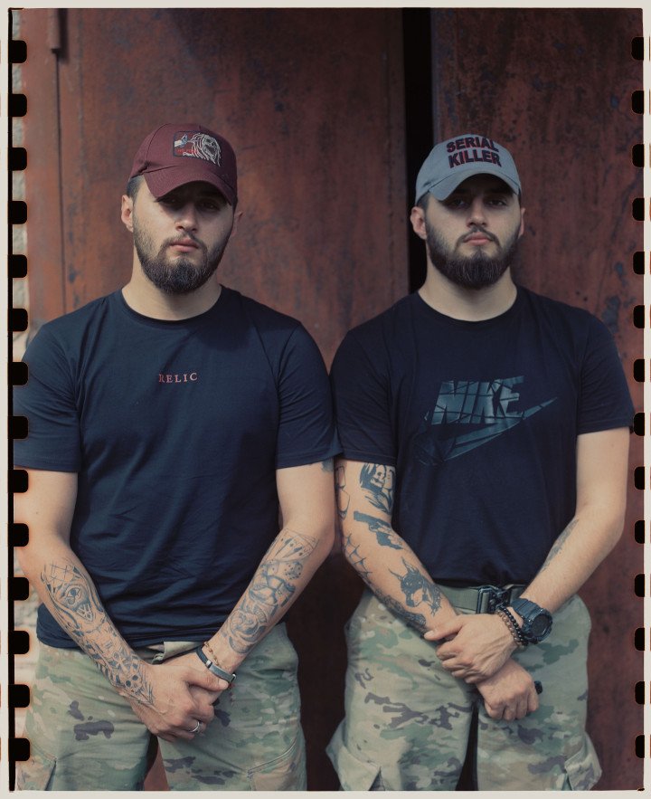 Twins, Groot and Xerox, pose for a portrait before getting some rest. Ukraine, August 2025. Photo by Lucile Brizard/UNITED24 Media.