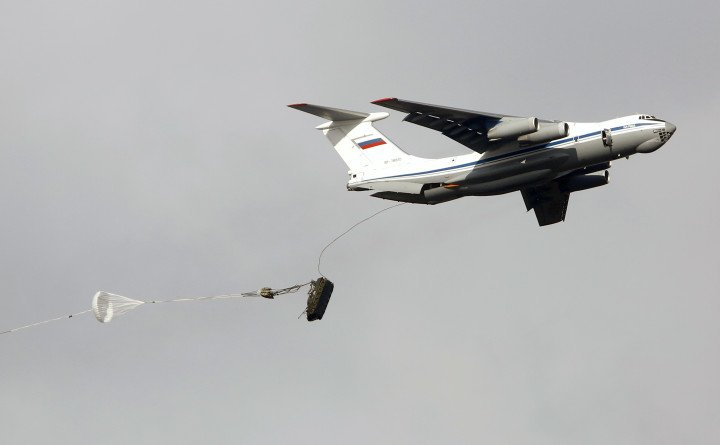 A Russian airborne infantry fighting vehicle BMD-2 is dropped from a plane during the  military exercise on November 7, 2016. 