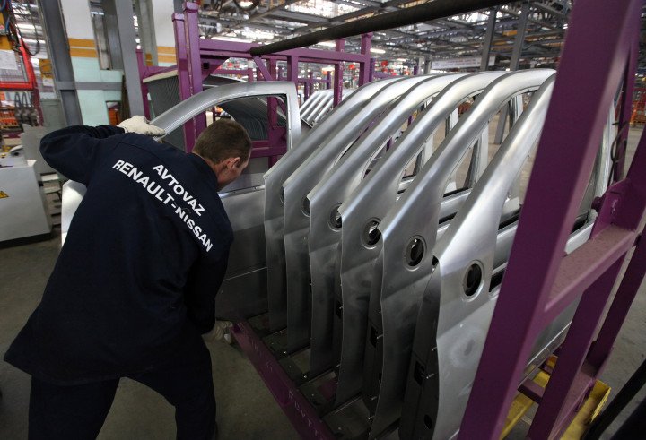 Factory worker installs door panels for a Lada Largus on the AvtoVAZ production line in Togliatti, Russia. (Photo: Bloomberg/Getty Images) Factory worker installs door panels for a Lada Largus on the AvtoVAZ production line in Togliatti, Russia. (Photo: Bloomberg/Getty Images)