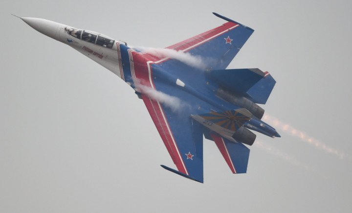 Russian Air Force Knights aerobatic team flies Su‑27 fighter jets during a rehearsal ahead of Airshow China 2014 in Zhuhai, China. (Photo: Getty Images)