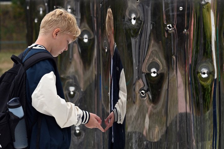 A boy attends a ceremony at the Babyn Yar memorial to mark the 83rd anniversary of the mass execution of Jews by the Nazis during World War II, in Kyiv on September 29, 2024. (Source: Getty Images) A boy attends a ceremony at the Babyn Yar memorial to mark the 83rd anniversary of the mass execution of Jews by the Nazis during World War II, in Kyiv on September 29, 2024. (Source: Getty Images)