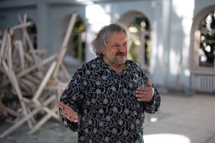 Theater director Vladyslav Troitskyi stands inside Kyiv's landmark October Palace. Founder of the multidisciplinary GogolFest, Troitskyi created a condensed version of the festival to keep Ukraine's contemporary arts scene active during wartime. (Photo: Vic Bakin/UNITED24)