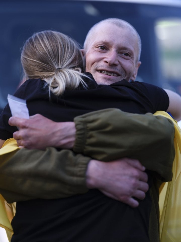 One of the freed Ukrainian POWs embraces a loved one upon return. (Source: Zelenskyy/Telegram) One of the freed Ukrainian POWs embraces a loved one upon return. (Source: Zelenskyy/Telegram)