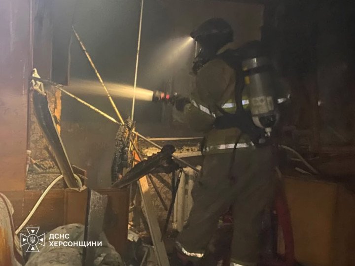 A firefighter works inside a building damaged by a Russian attack in the Kherson region. (Source: State Emergency Service of Ukraine) A firefighter works inside a building damaged by a Russian attack in the Kherson region. (Source: State Emergency Service of Ukraine)