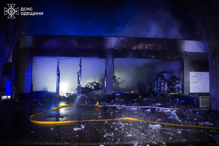 Firefighters extinguish a blaze at a damaged commercial building in Odesa following a Russian overnight attack. (Source: State Emergency Service of Ukraine)