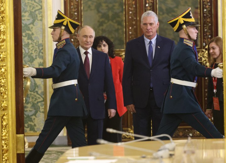 MOSCOW, RUSSIA – MAY 7: Cuban President Miguel Diaz-Canel (R) and Russian Leader Vladimir Putin (L) enter Yekaterina’s Hall during their meeting at the Grand Kremlin Palace, May 7, 2025 in Moscow, Russia. (Source: Getty Images)