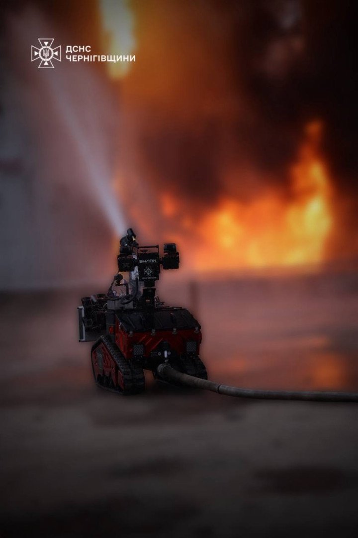 A firefighting robot operated by Ukraine’s State Emergency Service works to extinguish a blaze at an industrial site in Chernihiv after a Russian Shahed drone strike, October 5, 2025. (Source: State Emergency Service of Ukraine, Chernihiv Region)