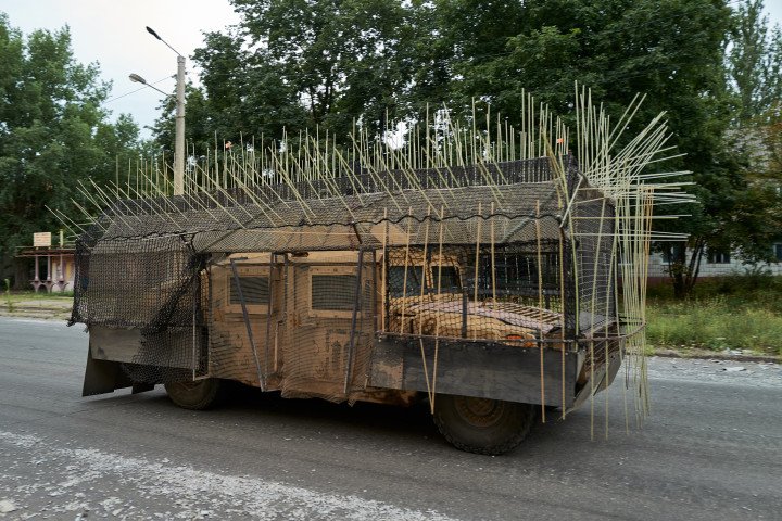 Ukrainian HMMWV equipped with cage armor to defend against FPV drones moves near the frontline city of Kostyantynivka. (Source: Getty Images)