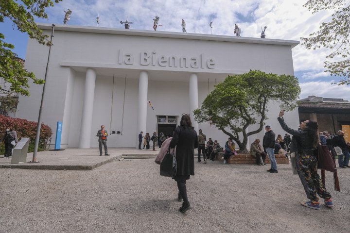Tourists and locals enter the Biennale's Central Pavilion during the 59th International Art Exhibition (Photo by Stefano Mazzola/Getty Images)