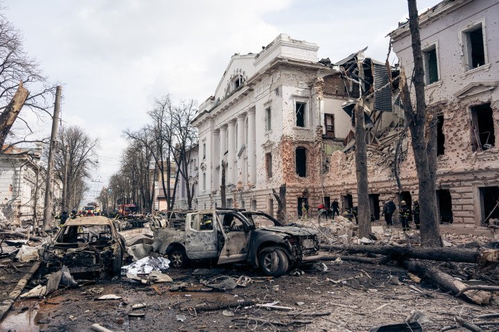 SUMY, UKRAINE - APRIL 13: Bodies of people killed in a Russian ballistic missile strike lie covered with emergency blankets at the strike site on April 13, 2025 in Sumy, Ukraine. The death toll after Russian ballistic missiles' attack on the center of Sumy has risen to 34, including two children. At least 117 people have been injured, including 15 children. On Palm Sunday, the Russian army launched two ballistic missiles with cluster munition at the central part of the city at a time when there were many people on the streets - dozens of people were killed and injured in the city; civilian infrastructure and residential buildings were damaged or destroyed. (Photo: Yehor Kryvoruchko. via Getty Images)