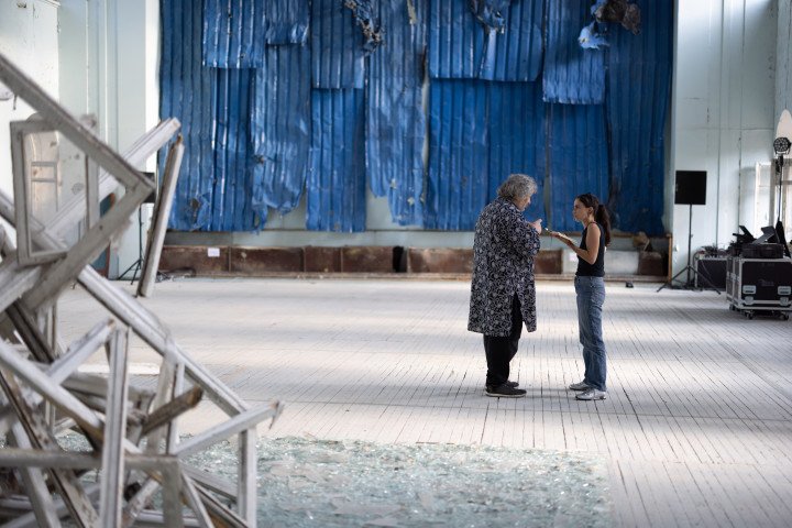 Theater director Vladyslav Troitskyi speaks during an interview alongside his installation at GogolFest. (Photo: Vic Bakin/UNITED24)