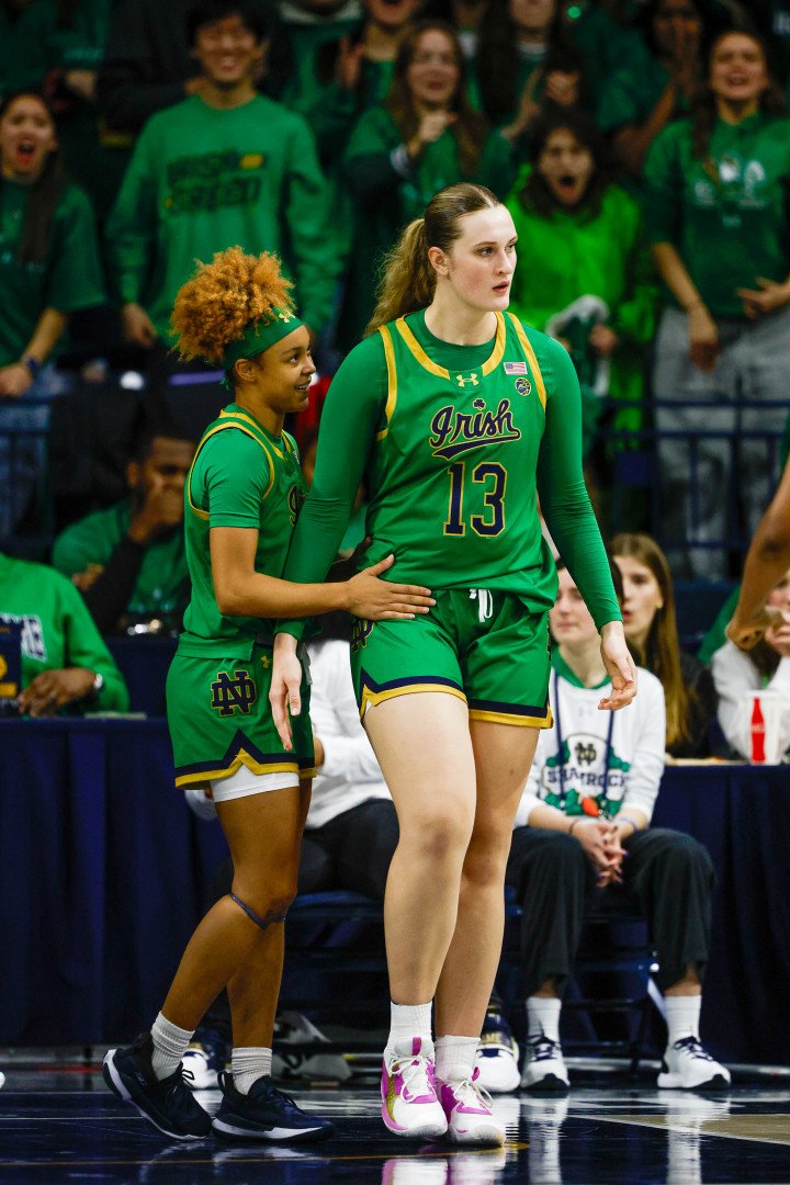 Kate Koval №13 is congratulated on her block by teammate Hannah Hidalgo №3 of Notre Dame during a game between Connecticut and Notre Dame at Purcell Pavillion at the Joyce Center on December 12, 2024, in South Bend, Indiana. (Source: Getty Images) Kate Koval №13 is congratulated on her block by teammate Hannah Hidalgo №3 of Notre Dame during a game between Connecticut and Notre Dame at Purcell Pavillion at the Joyce Center on December 12, 2024, in South Bend, Indiana. (Source: Getty Images)