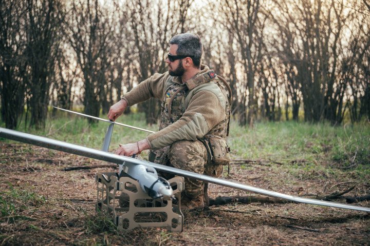 Ukrainian serviceman of the Unmanned Systems Battalion of the 23rd Mechanized Brigade prepares FlyEye reconnaissance drone for launch (Photo by Oxana Chorna via Getty Images)