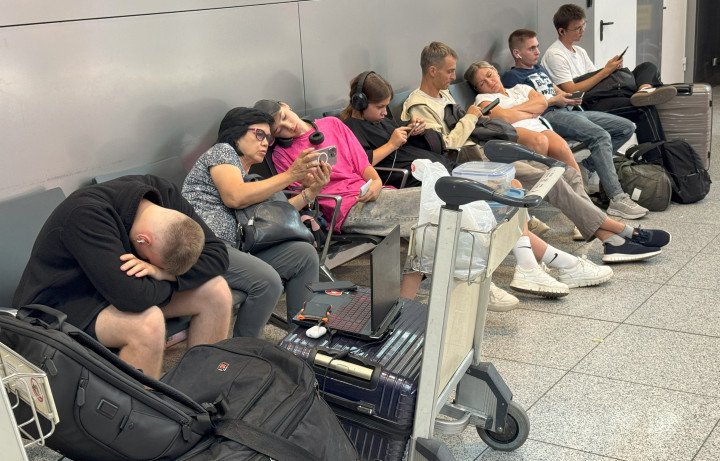 People wait for their flights at the Sheremetyevo International Airport, Moscow. (Photo by Tatyana Makeyeva via Getty Images)