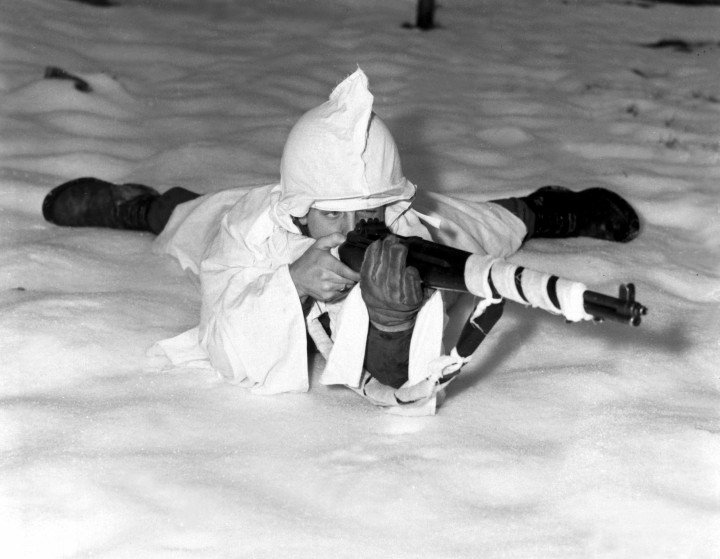 A Sergeant in the US Army, Sergeant Marvin Eans Jr. lies demonstrating a new snow cape for camouflage in snowy Belgium, December 15, 1944, with white rags wrapped around his rifle for additional concealment. (Photo: Richard Massenge/US Army/Interim Archives/Getty Images) Snow camouflage in world war II