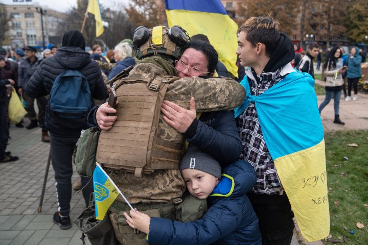 Local residents hug a Ukrainian soldier as they celebrate the liberation of Kherson, on November 13, 2022, amid Russia's invasion of Ukraine. (Source: Getty Images) Local residents hug a Ukrainian soldier as they celebrate the liberation of Kherson, on November 13, 2022, amid Russia's invasion of Ukraine. (Source: Getty Images)