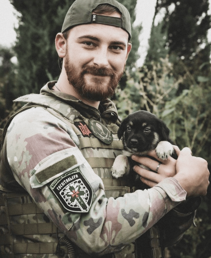 Hospitallers combat medic “Liutyi” holding a puppy. Photo: courtesy of Liutyi instagram page. Hospitallers combat medic “Liutyi” holding a puppy. Photo: courtesy of Liutyi instagram page.