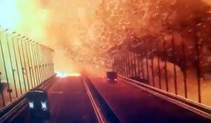 A screen grab from a surveillance footage shows flames and smoke rising up after an explosion at the Kerch bridge in the Kerch Strait, Crimea, October 8, 2022. (Source: Getty Images) A screen grab from a surveillance footage shows flames and smoke rising up after an explosion at the Kerch bridge in the Kerch Strait, Crimea, October 8, 2022. (Source: Getty Images)