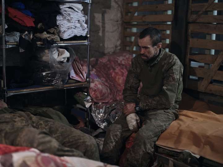 A wounded soldier awaits the next evacuation link. Medics provide first aid at a stabilisation point near the Kurakhove frontline, Donetsk region, (Photo by Vlada Liberova/Libkos/Getty) A wounded soldier awaits the next evacuation link. Medics provide first aid at a stabilisation point near the Kurakhove frontline, Donetsk region, (Photo by Vlada Liberova/Libkos/Getty)