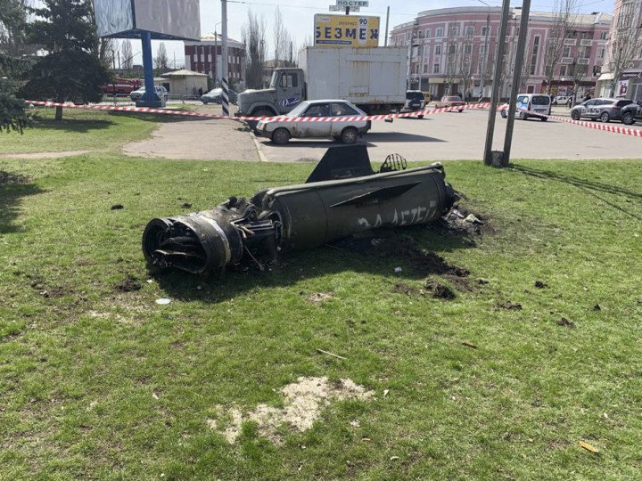 The remains of a rocket with the lettering “for our children” lie on an area of grass, after a rocket attack on the railway station in the eastern city of Kramatorsk, in the Donetsk region on April 8, 2022. (Photo by HERVE BAR/AFP via Getty Images)