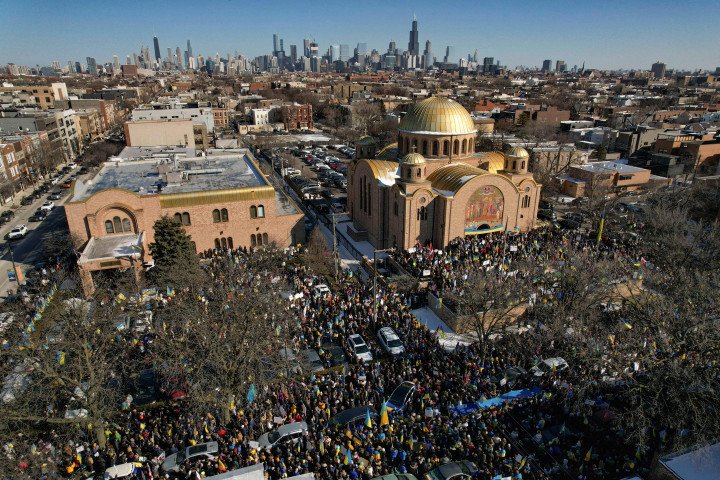 Demonstrators gather during a protest against the Russian invasion of Ukraine in front of Saints Volodymyr and Olha Ukrainian Church in Chicago, Illinois, on February 27, 2022. (Photo by CHENEY ORR / AFP) (Photo by CHENEY ORR/AFP via Getty Images) Demonstrators gather during a protest against the Russian invasion of Ukraine in front of Saints Volodymyr and Olha Ukrainian Church in Chicago, Illinois, on February 27, 2022. (Photo by CHENEY ORR / AFP) (Photo by CHENEY ORR/AFP via Getty Images)