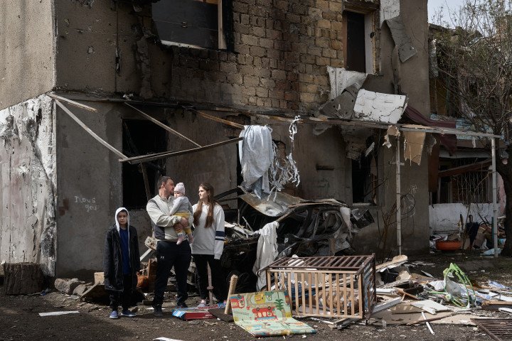 A Ukrainian family outside their destroyed apartment, which was hit on April 23 by the Russian strike drone Shahed-136, on April 24, 2024 in Odesa, Ukraine. (Source: Libkos via Getty Images) A Ukrainian family outside their destroyed apartment, which was hit on April 23 by the Russian strike drone Shahed-136, on April 24, 2024 in Odesa, Ukraine. (Source: Libkos via Getty Images)