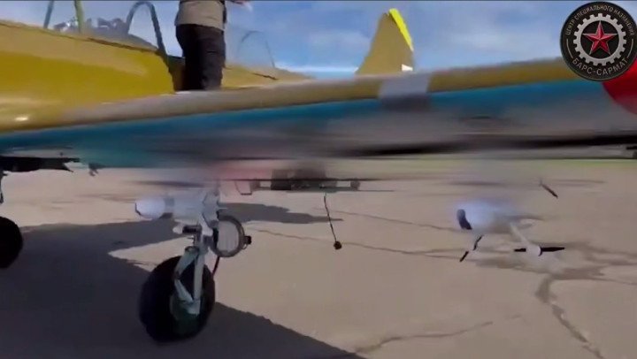 A modified Russian Yak-52 carrying multiple FPV interceptor drones beneath its wings before takeoff. (Source: BARS-Sarmat/Telegram) A modified Russian Yak-52 carrying multiple FPV interceptor drones beneath its wings before takeoff. (Source: BARS-Sarmat/Telegram)