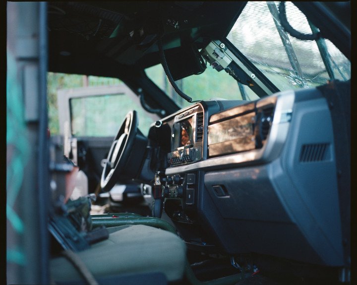 Inside the APC which will take the UAV pilots to their positions. The windscreen was recently pierced by a bullet. Ukraine, August 2025. Photo by Lucile Brizard/UNITED24 Media.