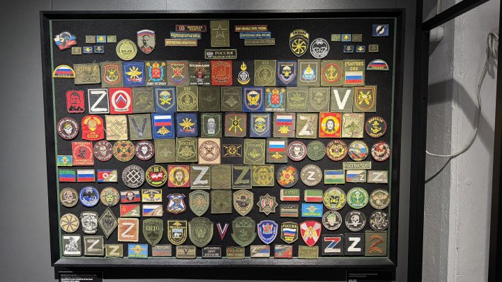 A display of trophy patches collected from Russian and North Korean military units, seized on the battlefield. (Source: Forces News) A display of trophy patches collected from Russian and North Korean military units, seized on the battlefield. (Source: Forces News)