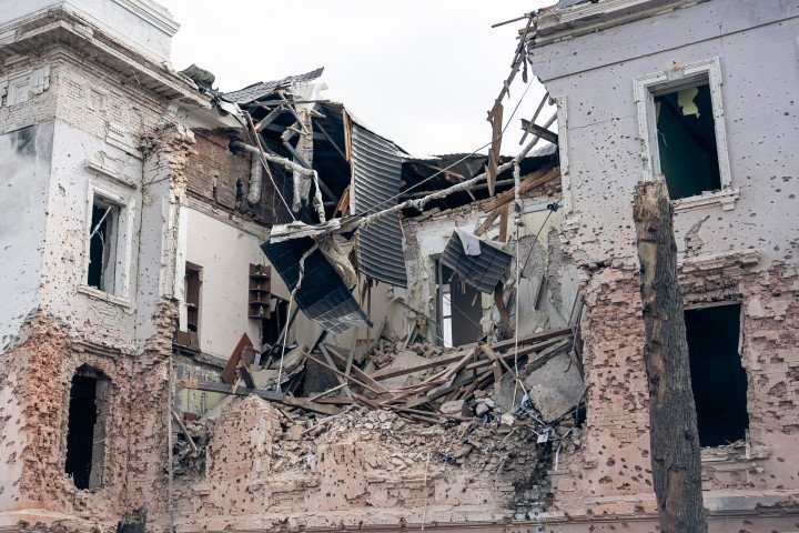 SUMY, UKRAINE - APRIL 13: A building in the city center is partially destroyed by a Russian ballistic missile strike on April 13, 2025 in Sumy, Ukraine. The death toll after Russian ballistic missiles' attack on the center of Sumy has risen to 34, including two children. At least 117 people have been injured, including 15 children. On Palm Sunday, the Russian army launched two ballistic missiles with cluster munition at the central part of the city at a time when there were many people on the streets - dozens of people were killed and injured in the city; civilian infrastructure and residential buildings were damaged or destroyed. (Photo by Oleksandr Oleksienko via Getty Images)