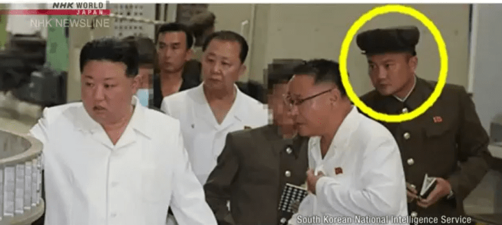 A North Korean expert with Kim Jong Un. (Source: NHK World Japan) A North Korean expert with Kim Jong Un. (Source: NHK World Japan)