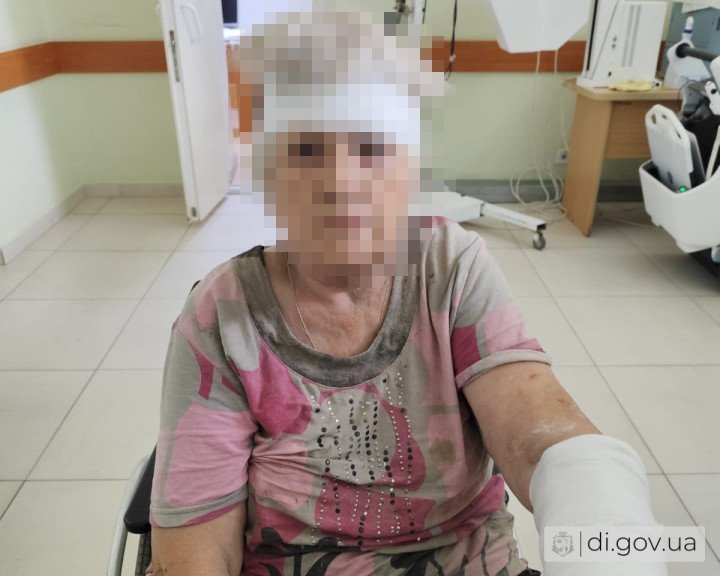 A woman receives medical treatment after being injured in a Russian guided aerial bomb attack on the village of Slatyne in Ukraine's Kharkiv region on July 14. (Source: Derhachi City Military Administration)