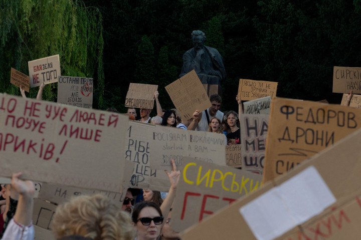 Protesters hold signs during a demonstration against the dismissal of former Defense Minister Mykhailo Fedorov in Kyiv, July 17, 2026. (Source: Getty Images) Protesters hold signs during a demonstration against the dismissal of former Defense Minister Mykhailo Fedorov in Kyiv, July 17, 2026. (Source: Getty Images)