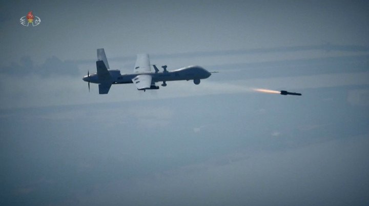 North Korean clone on US MQ-9 Reaper fires a copy of US Hellfire air-to-surface missile during North Korean army drills. (Source: open source)