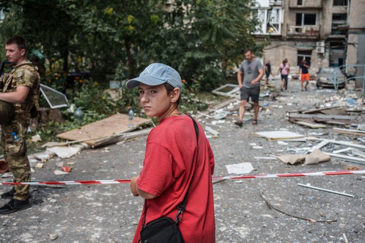 A boy standing next to a barricade tape amid debris in a yard of residential building damaged by Russian shelling, Pokrovsk. (Source: Serhii Korovayny via Getty Images) A boy standing next to a barricade tape amid debris in a yard of residential building damaged by Russian shelling, Pokrovsk. (Source: Serhii Korovayny via Getty Images)